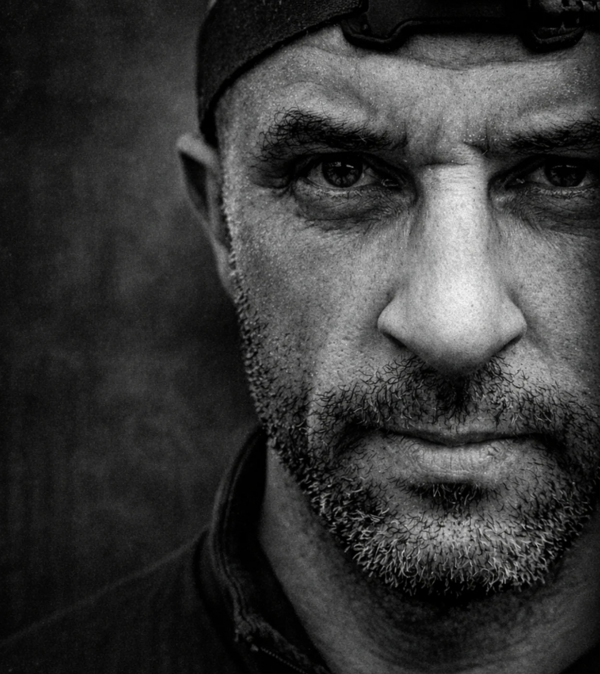 Black and white close-up portrait of Daniel, Halfell's founder, wearing a headband